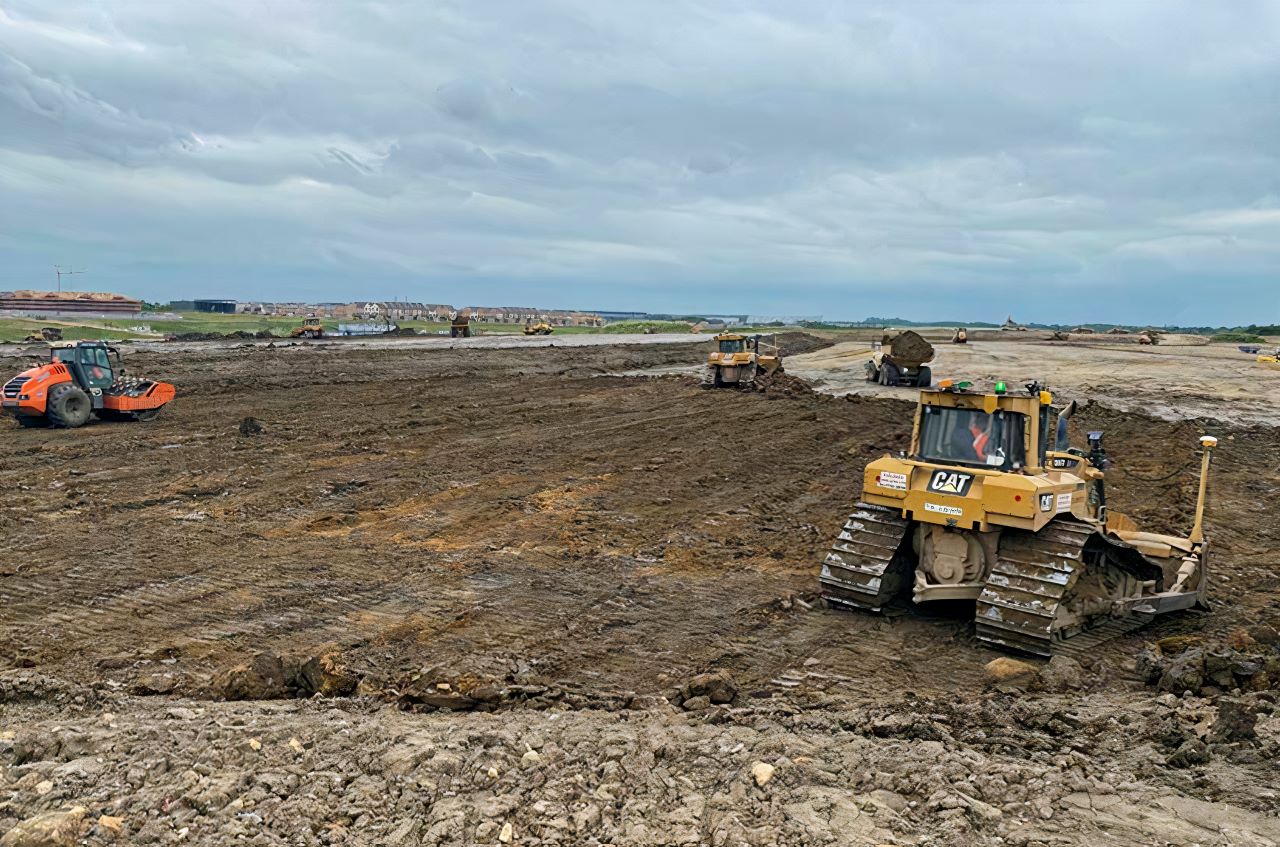 County Civils' fleet of GPS-guided bulldozers undertaking bulk earthworks and site preparation for a major UK residential development