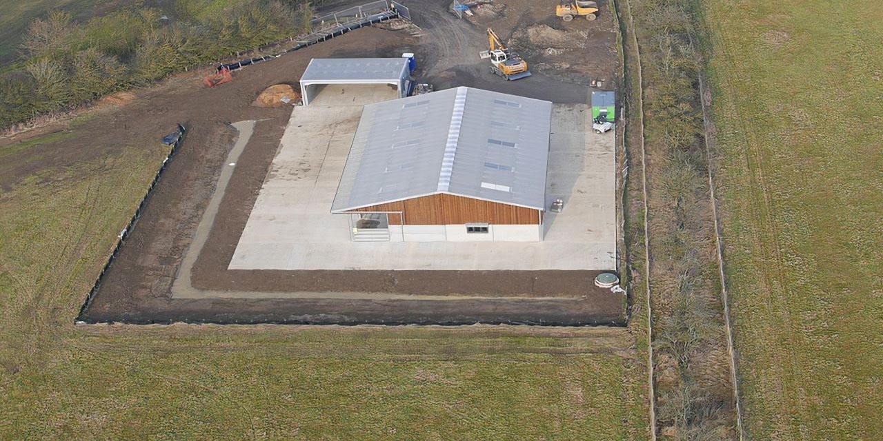 County Civils' complete groundworks package for a new UK agricultural facility, showing the large concrete foundation slab, drainage, and site access.